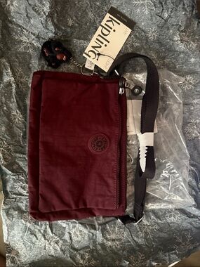 Kipling Burgundy Crossbody Messenger Bag with Black Strap